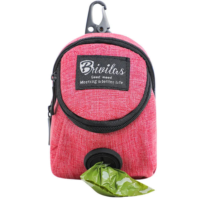 Pink pet waste bag dispenser with a green bag on a white background