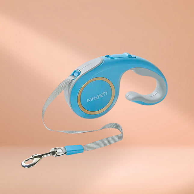 Blue retractable dog leash with Kimpet branding on a peach background