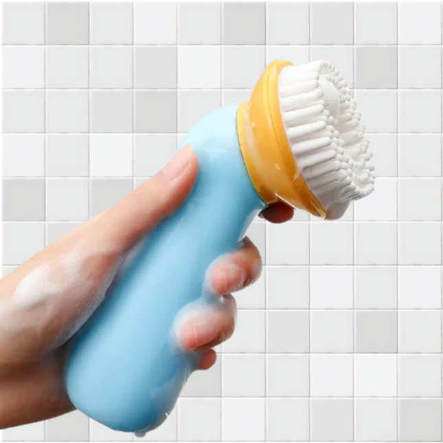 Hand holding a blue and yellow scrubbing brush against a tiled bathroom wall.
