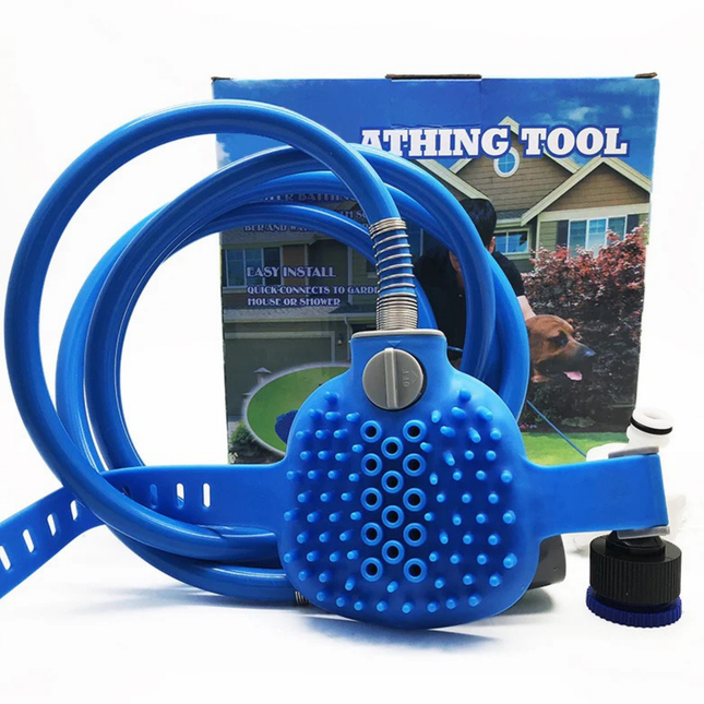 Blue pet grooming tool with a hose attachment in front of a product packaging box.