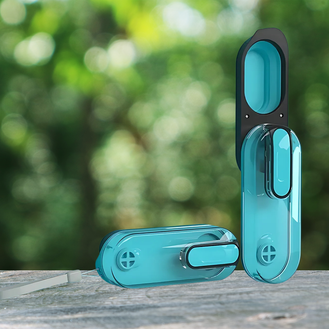 Turquoise window handles on a wooden surface with a blurred green outdoor background