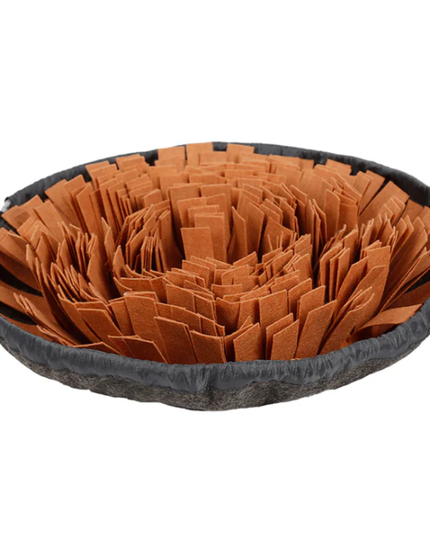 Pet bed with brown crumpled paper and black outer rim on a white background
