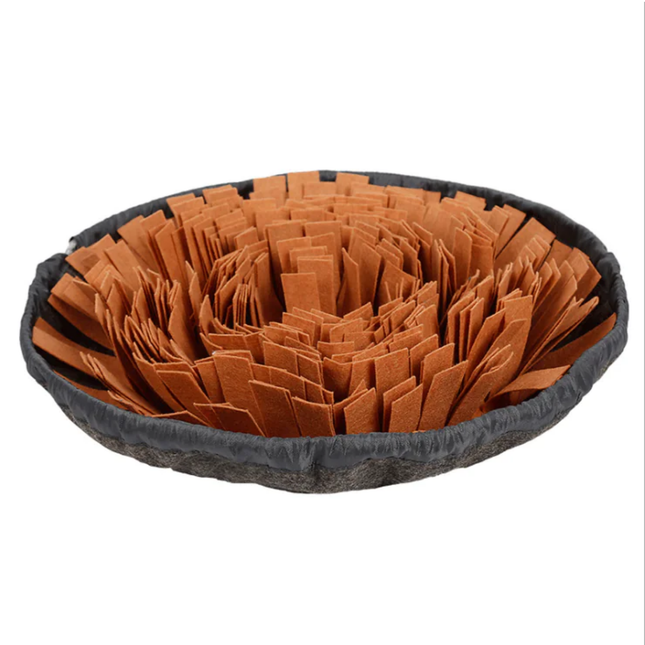 Pet bed with brown crumpled paper and black outer rim on a white background