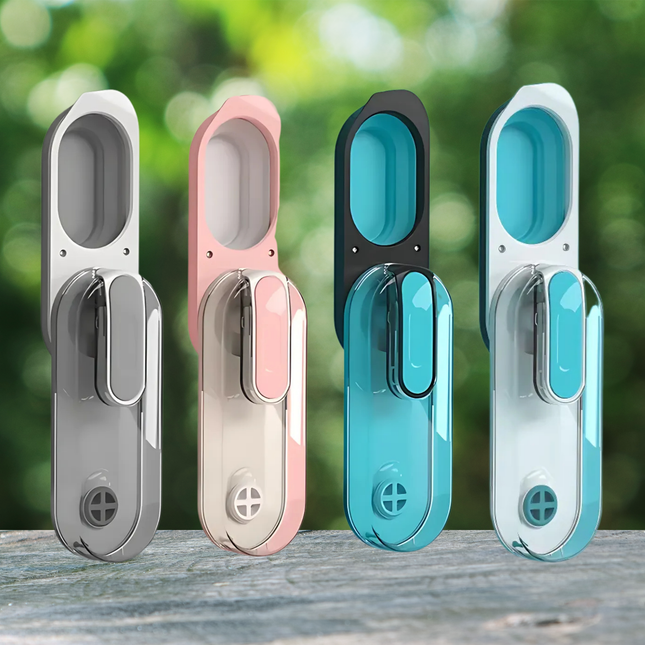 Four colorful door handles on a wooden surface with a blurred green background