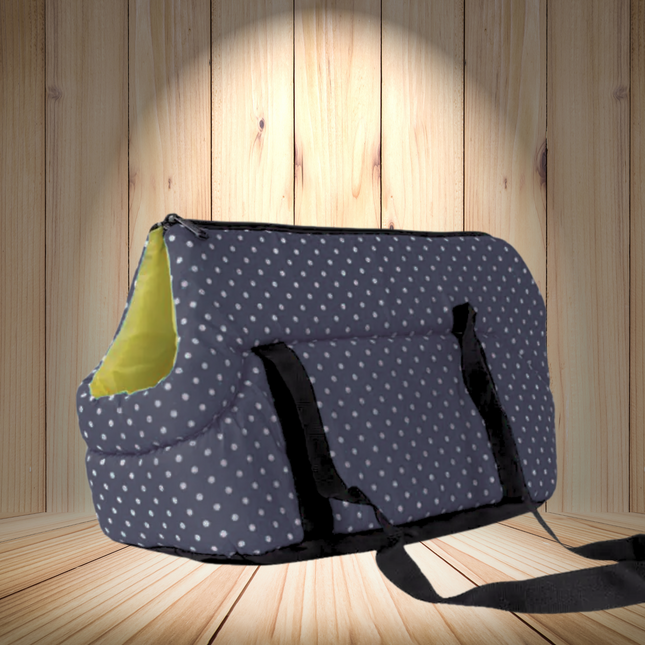 Dog carrier with polka dot pattern on a wooden floor and wall background