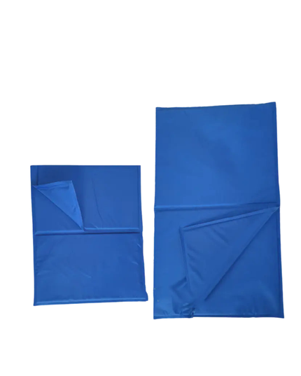 Two blue towels, one folded and one unfolded, on a white background