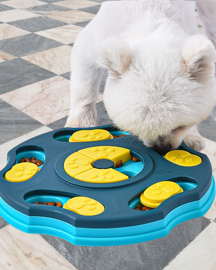 Dog interacting with a blue and yellow puzzle toy on a checkered floor.