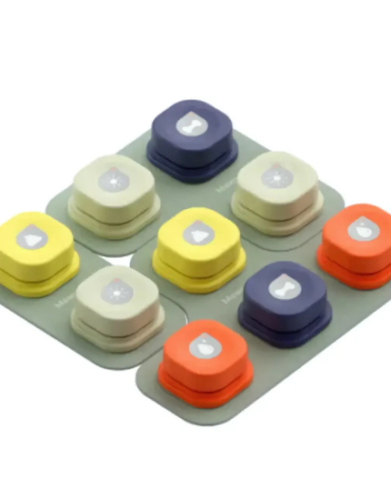 Set of colorful round objects on a gray tray with a white background