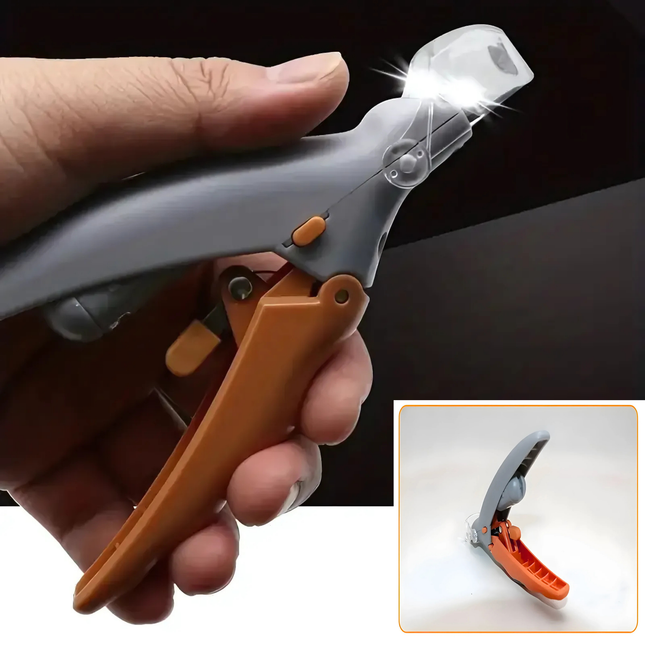 Hand holding a tool with a light on a dark background