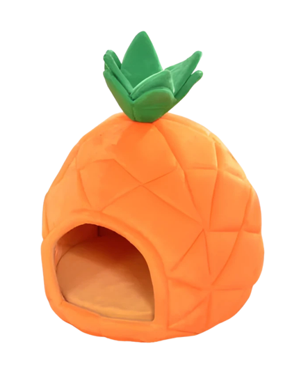 Pineapple-shaped pet bed with green top on a white background
