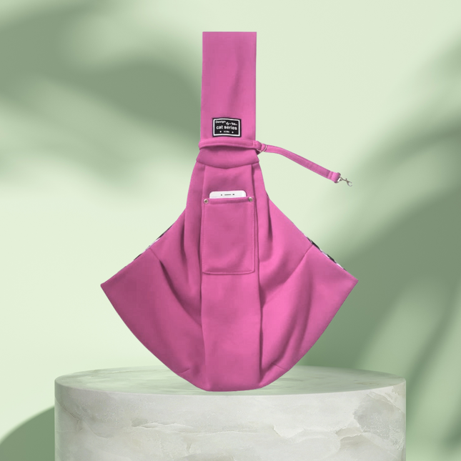 Pink sling bag on a light green background