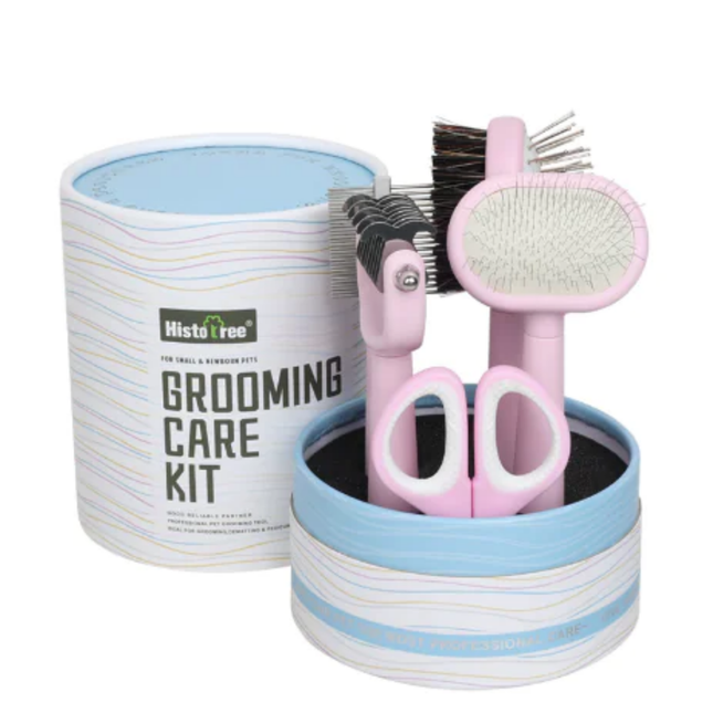 Pet grooming care kit with tools including a brush, comb, and scissors in a striped container.
