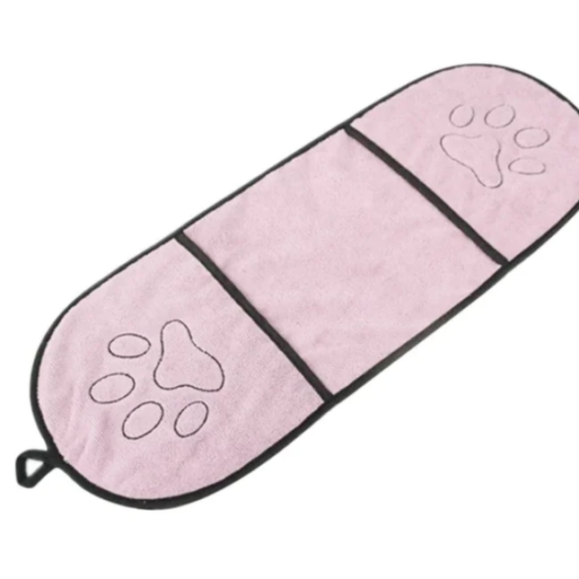 Pink pet mat with paw print designs on a white background