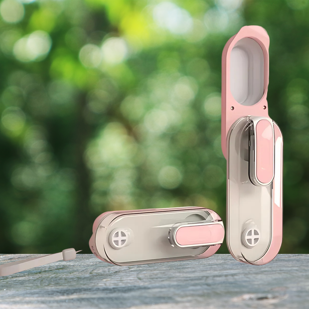 Pink and silver door lock set against a blurred green outdoor background