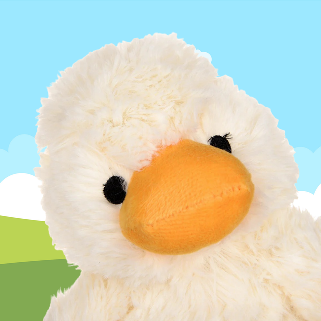 Close-up of a plush duck toy with a light blue background