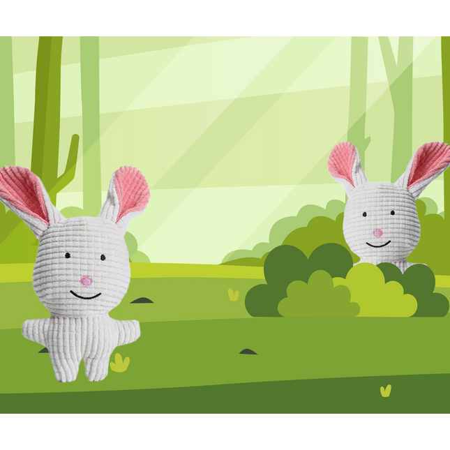 Two white stuffed animals with pink ears in a stylized forest setting