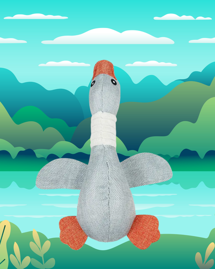 Plush goose toy with a colorful background of mountains and water