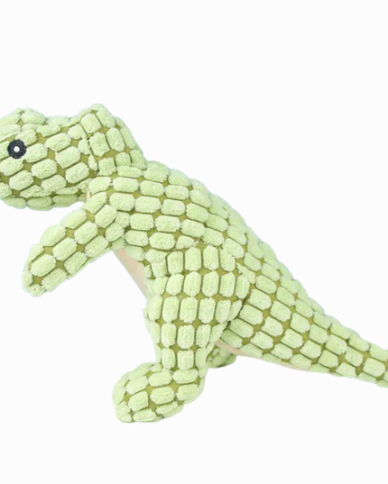 Green dinosaur-shaped plush toy on a white background