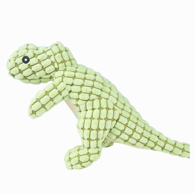 Green dinosaur-shaped plush toy on a white background