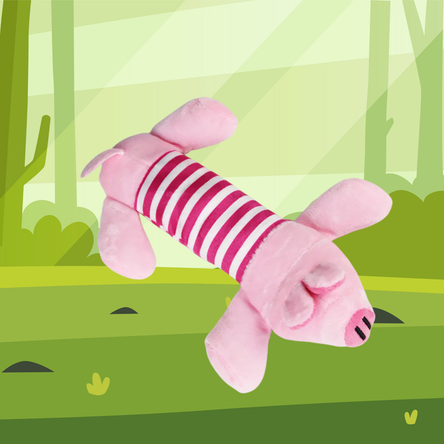 Pink plush toy with striped pattern on a green forest background