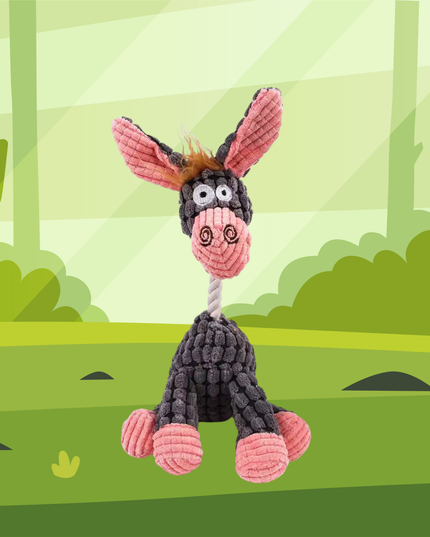 Plush donkey toy with pink ears and black body on a green forest background