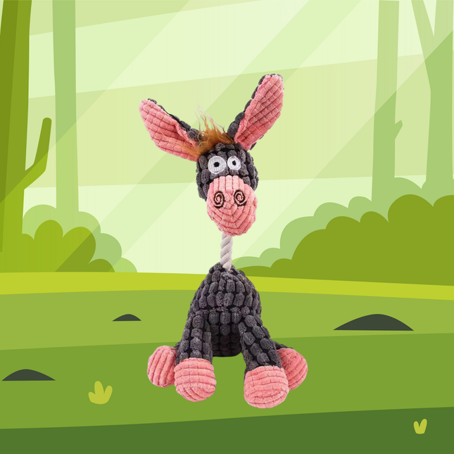 Plush donkey toy with pink ears and black body on a green forest background