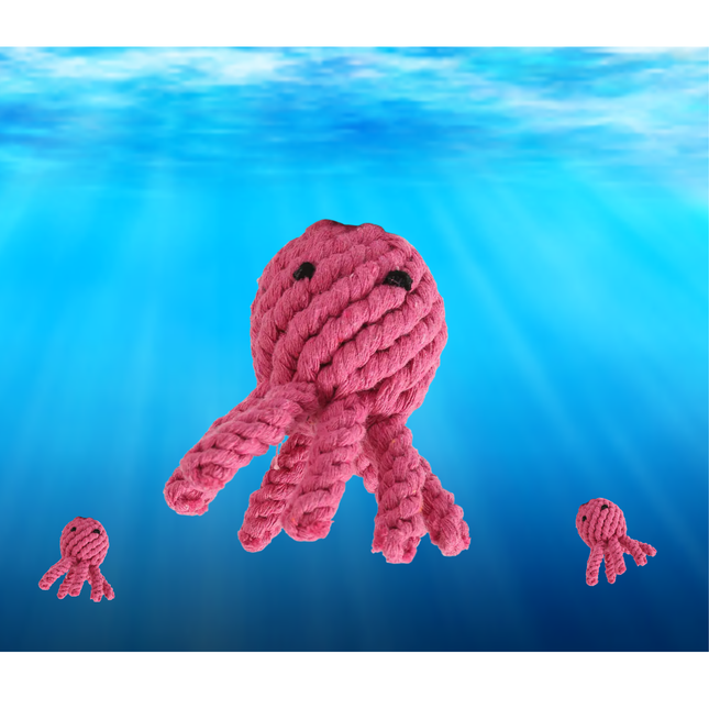Pink knitted octopus toy with smaller versions on a blue underwater background