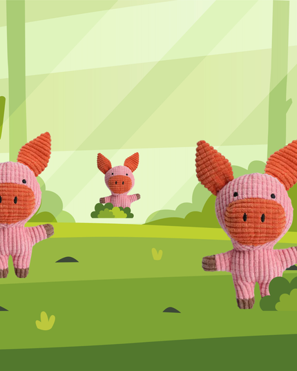 Three pink cartoon pigs with orange snouts on a green background