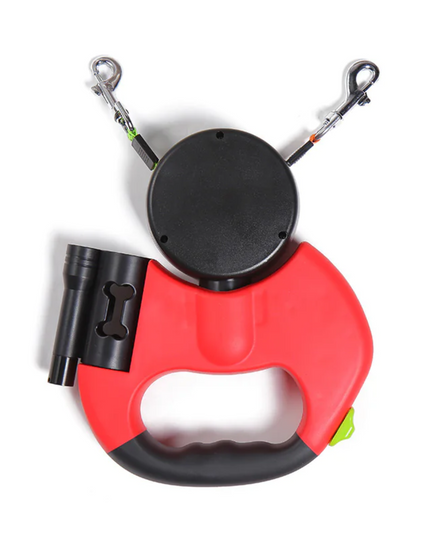Red and black retractable dog leash with flashlight on a white background