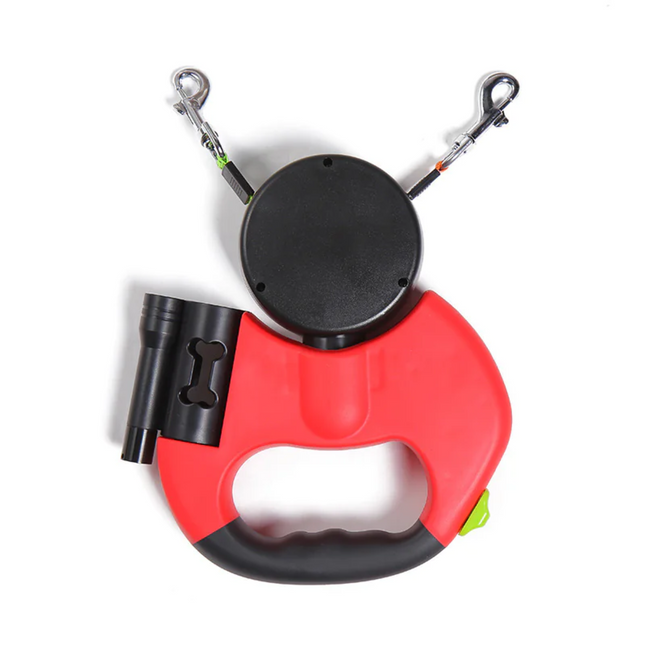 Red and black retractable dog leash with flashlight on a white background