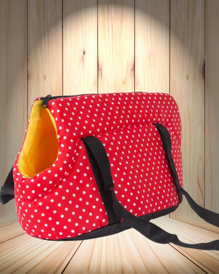 Red polka dot bag with a yellow interior on a wooden floor.