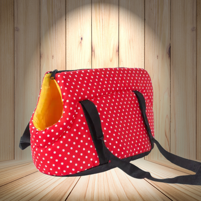 Red polka dot bag with a yellow interior on a wooden floor.