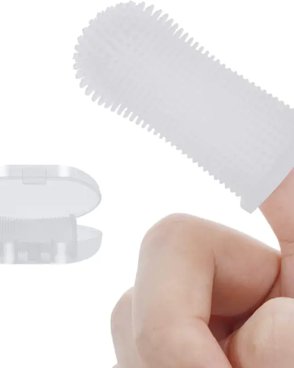 White plastic tool with textured surface held by a hand on a white background