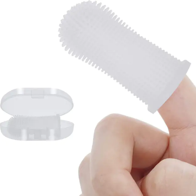 White plastic tool with textured surface held by a hand on a white background